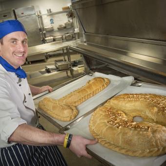 Eden Chef with two pasties spelling the number 10 for the 10 anniversary